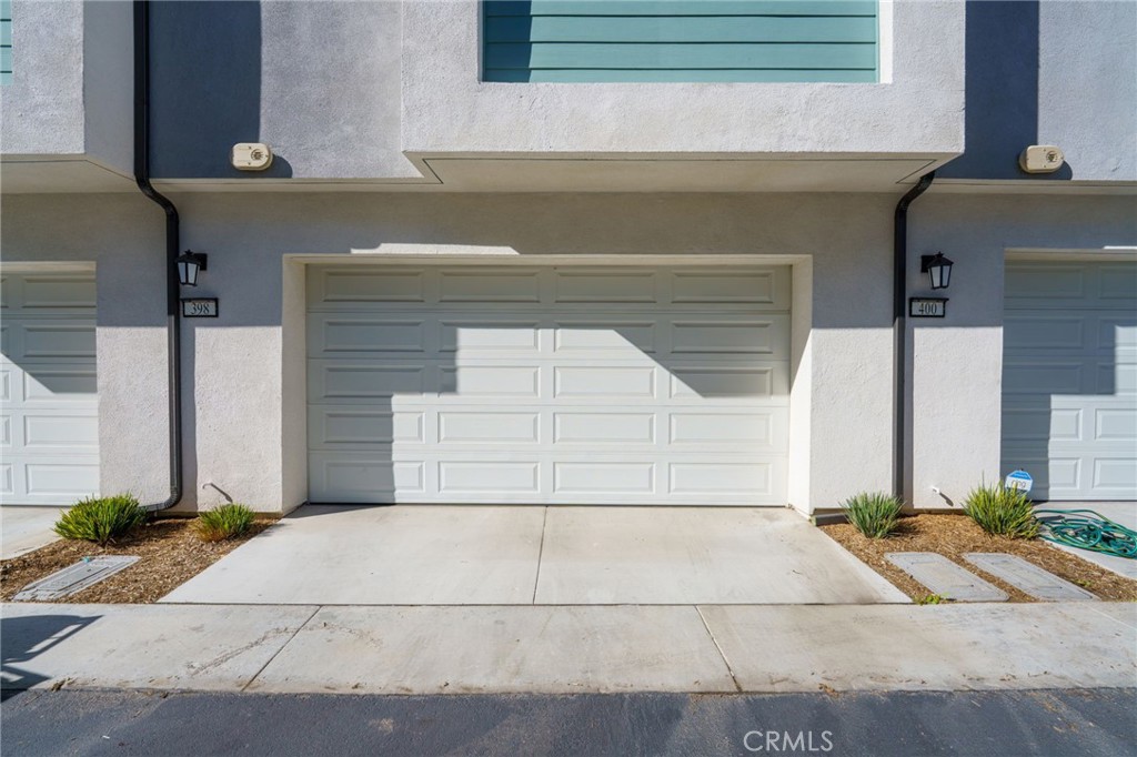 398 Merit Irvine, CA 92618 - Photo 34 of 55 a view of entrance gate of house and car parked