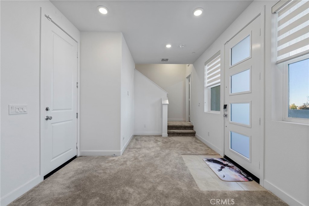 398 Merit Irvine, CA 92618 - Photo 8 of 55 a view of a hallway with closet and entryway