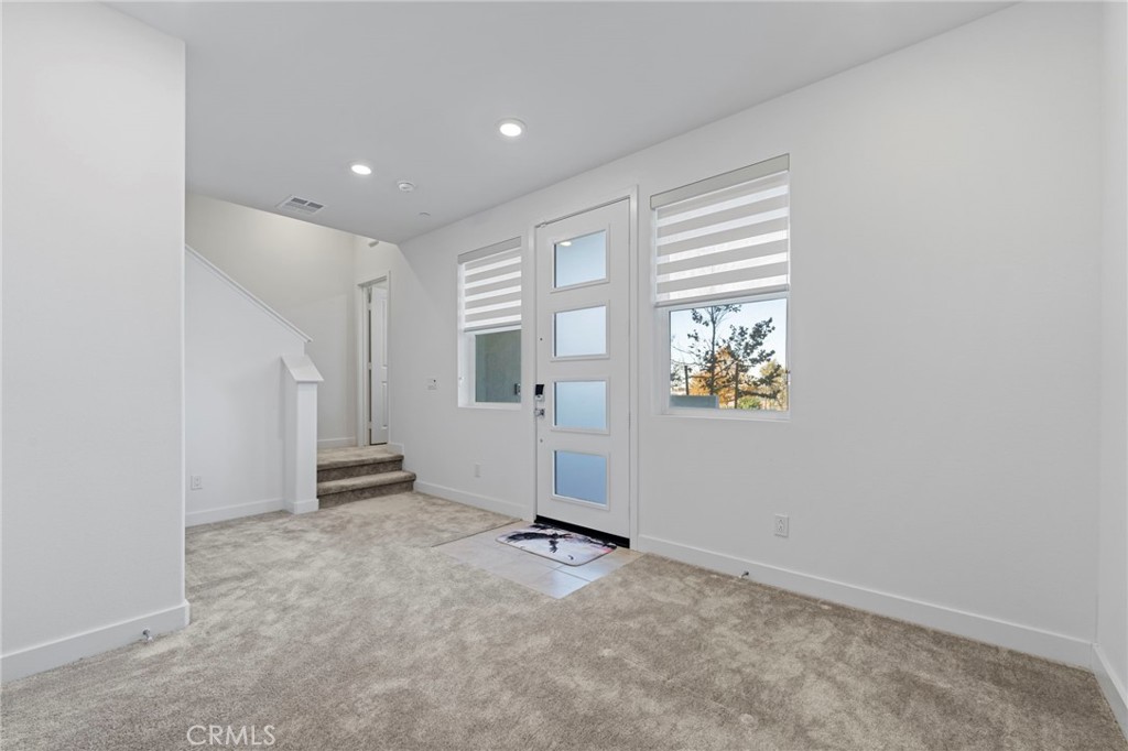 398 Merit Irvine, CA 92618 - Photo 9 of 55 an empty room with windows
