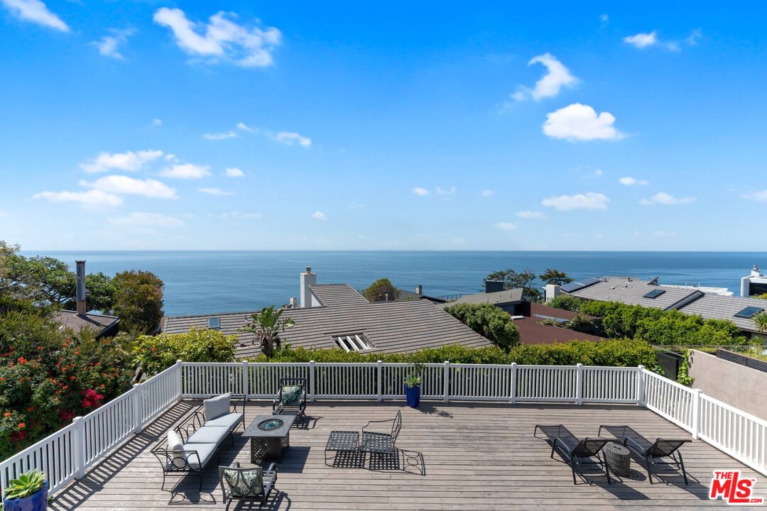 31518 Broad Beach Road Malibu, CA 90265 - Photo 2 of 27 a view of a terrace with lawn chairs