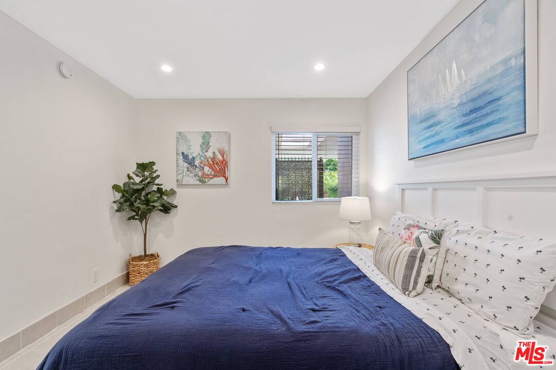 31518 Broad Beach Road Malibu, CA 90265 - Photo 21 of 27 a bed sitting in a bedroom next to a window