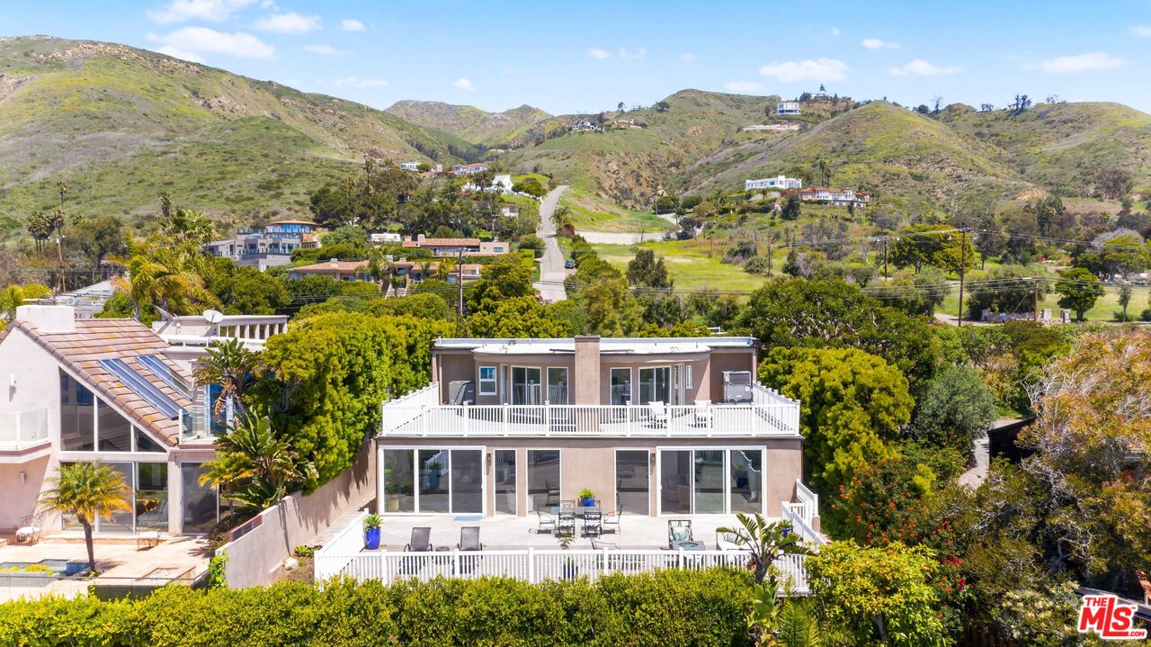 31518 Broad Beach Road Malibu, CA 90265 - Photo 4 of 27 a view of a house with a mountain in the background