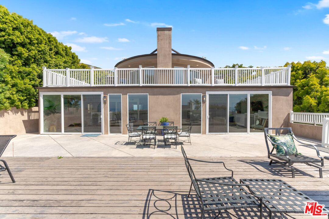 31518 Broad Beach Road Malibu, CA 90265 - Photo 5 of 27 a front view of a house with a lounge chair