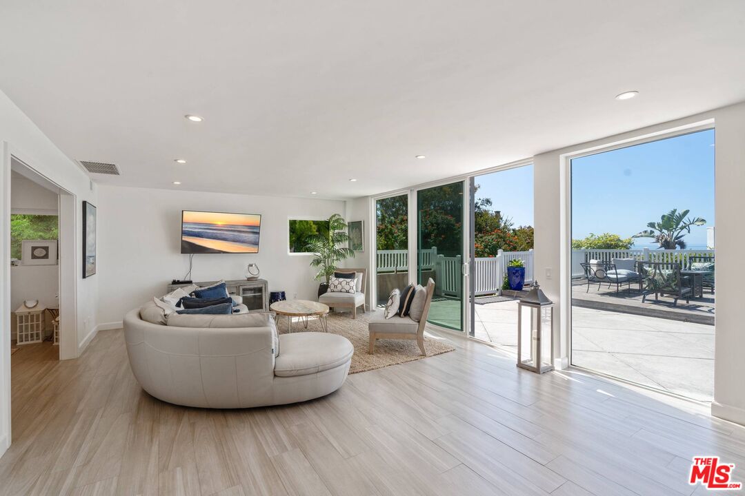 31518 Broad Beach Road Malibu, CA 90265 - Photo 8 of 27 a living room with furniture and a large window