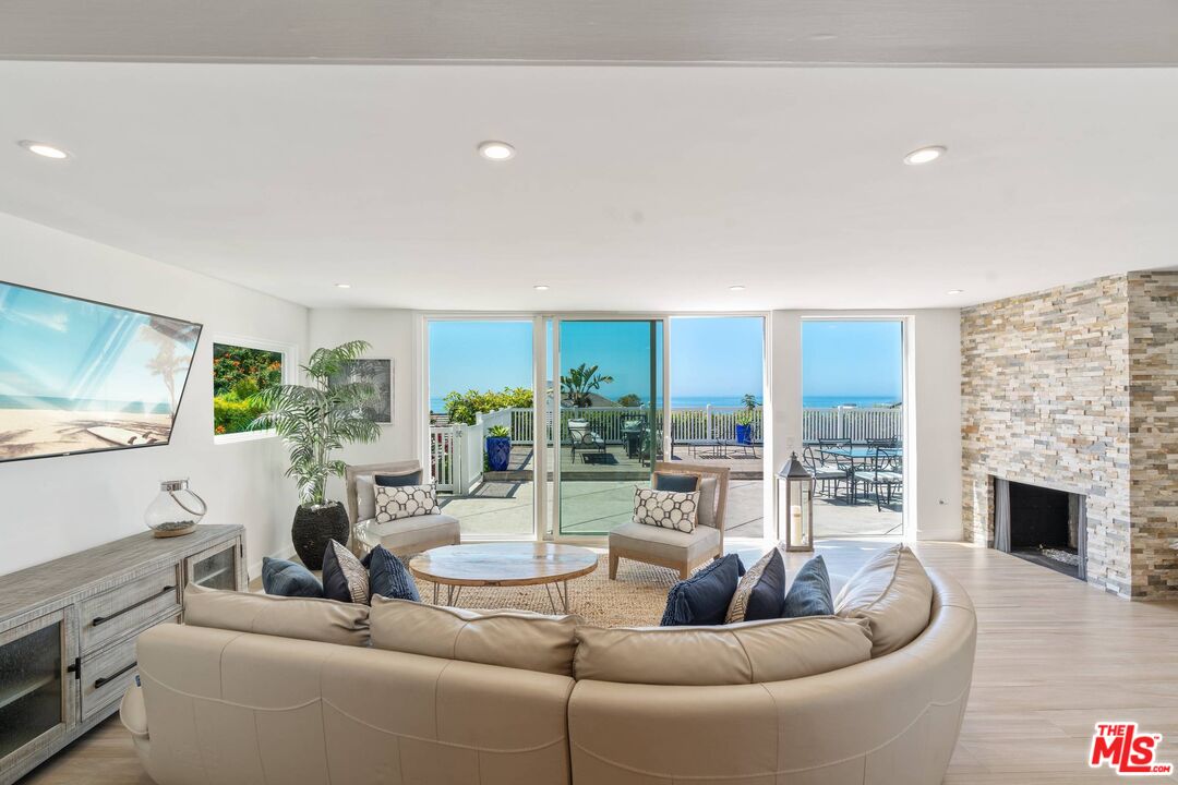 31518 Broad Beach Road Malibu, CA 90265 - Photo 9 of 27 a living room with furniture and a flat screen tv