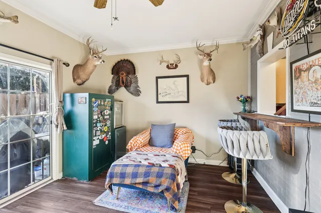 a bedroom with furniture and a window