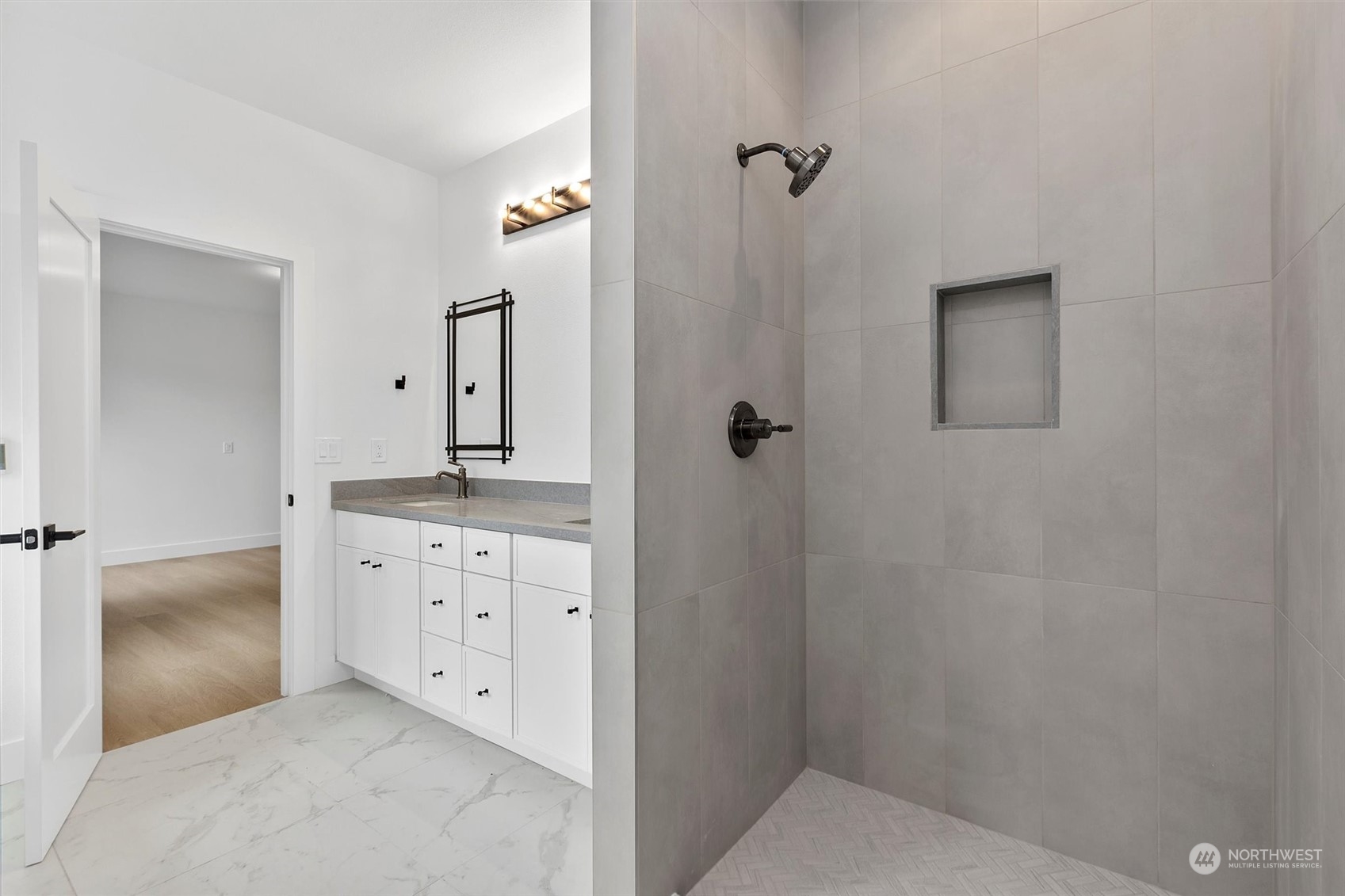 22713 1st Place West Bothell, WA 98021 - Photo 14 of 29 a bathroom with a granite countertop sink a mirror and a