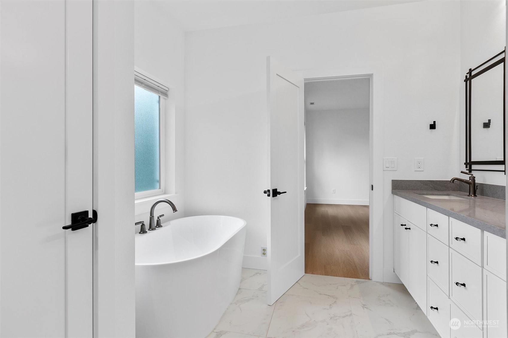 22713 1st Place West Bothell, WA 98021 - Photo 15 of 29 a bathroom with a granite countertop sink and a mirror