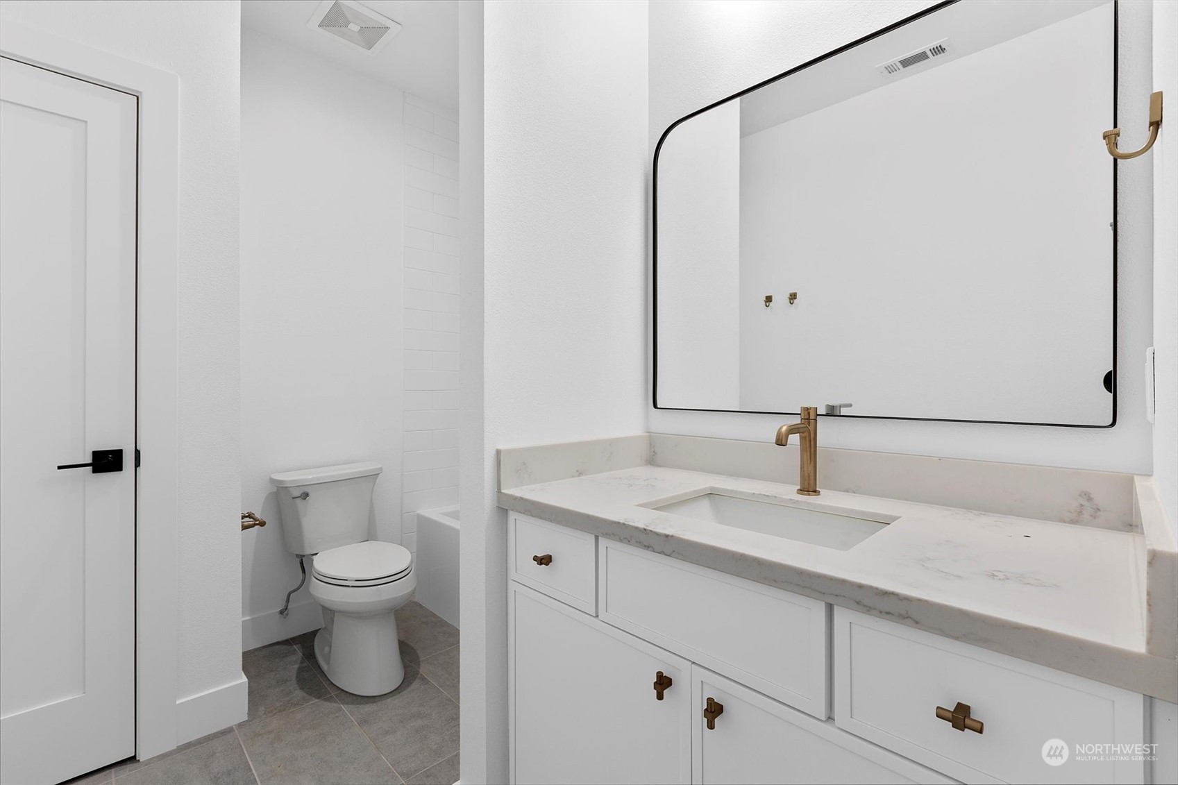22713 1st Place West Bothell, WA 98021 - Photo 20 of 29 a bathroom with a granite countertop sink and a mirror