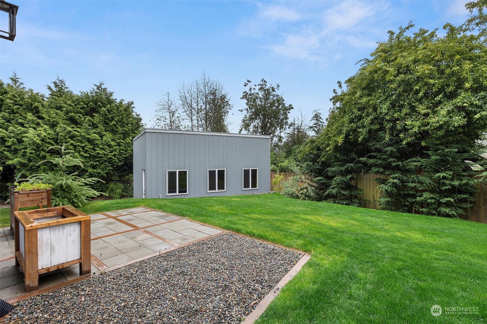 22713 1st Place West Bothell, WA 98021 - Photo 23 of 29 a view of backyard with outdoor seating and green space
