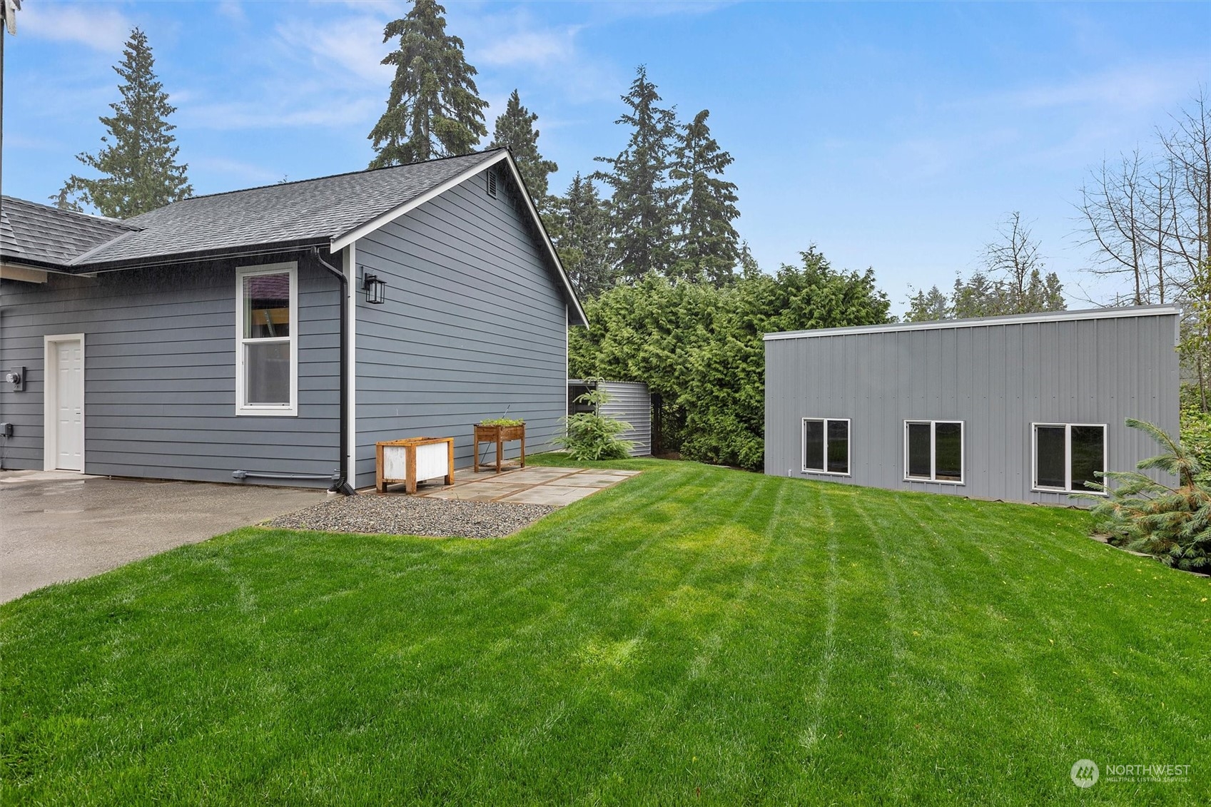 22713 1st Place West Bothell, WA 98021 - Photo 24 of 29 a backyard of a house with table and chairs