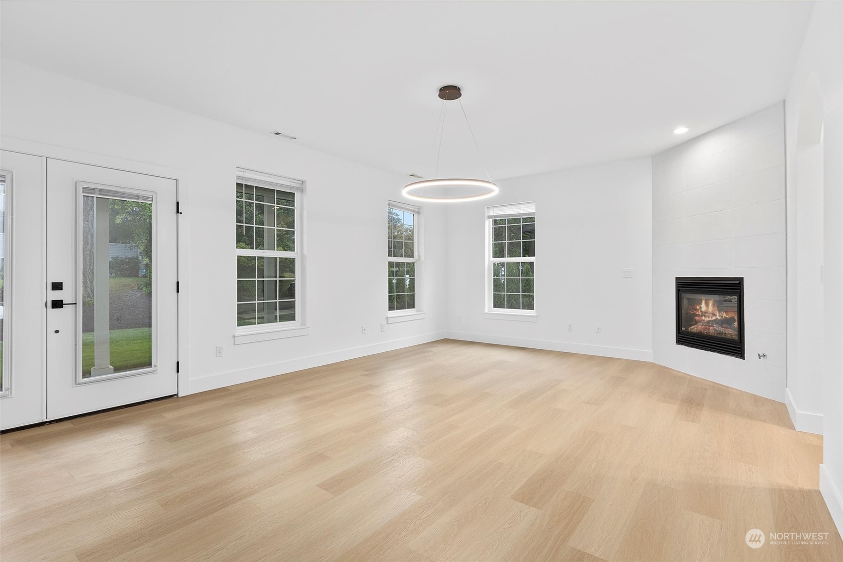 22713 1st Place West Bothell, WA 98021 - Photo 4 of 29 a view of an empty room with a window and fireplace