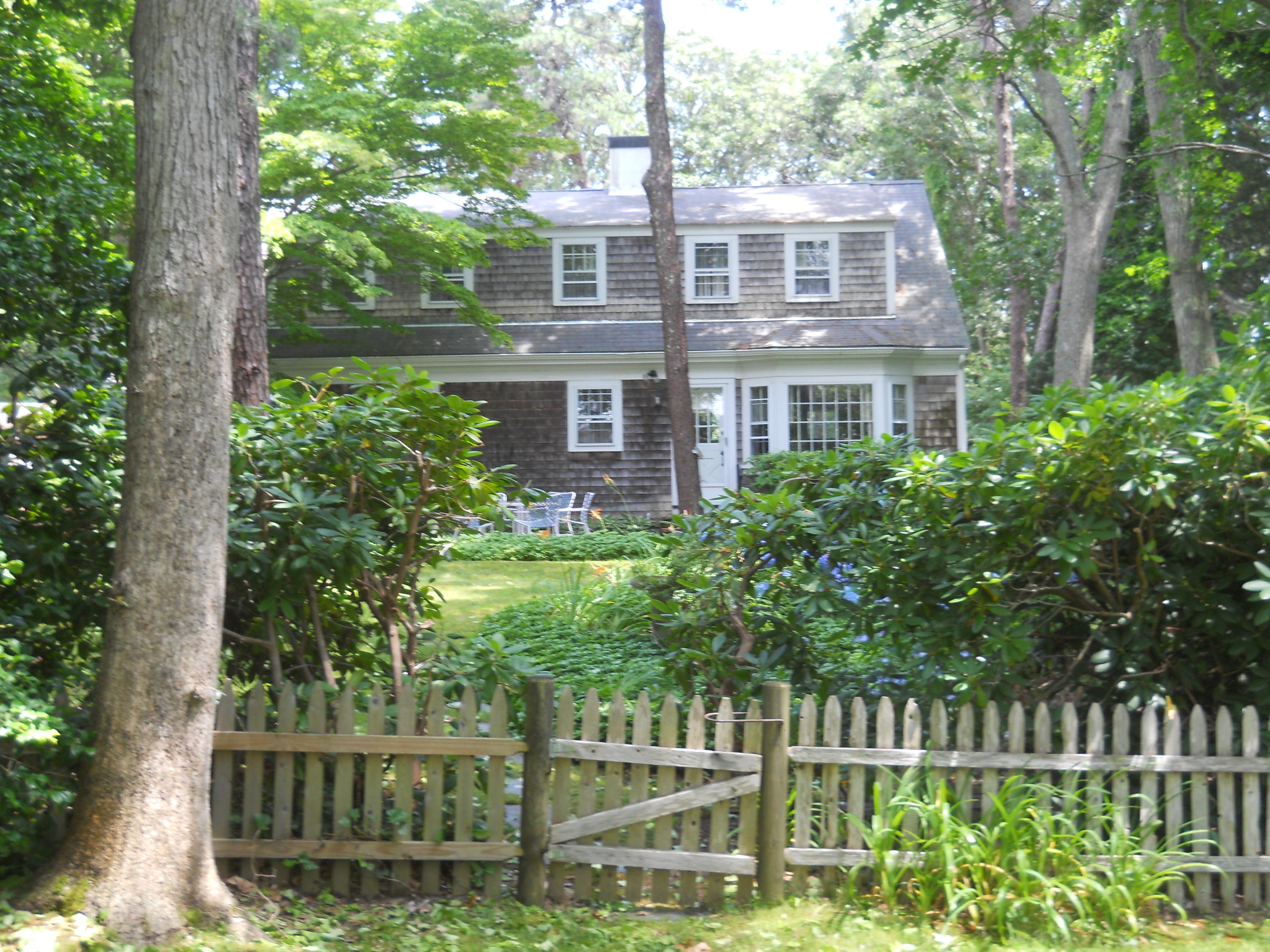 87 Eel River Road Osterville, MA 02655 - Photo 15 of 29 a front view of a house with a garden