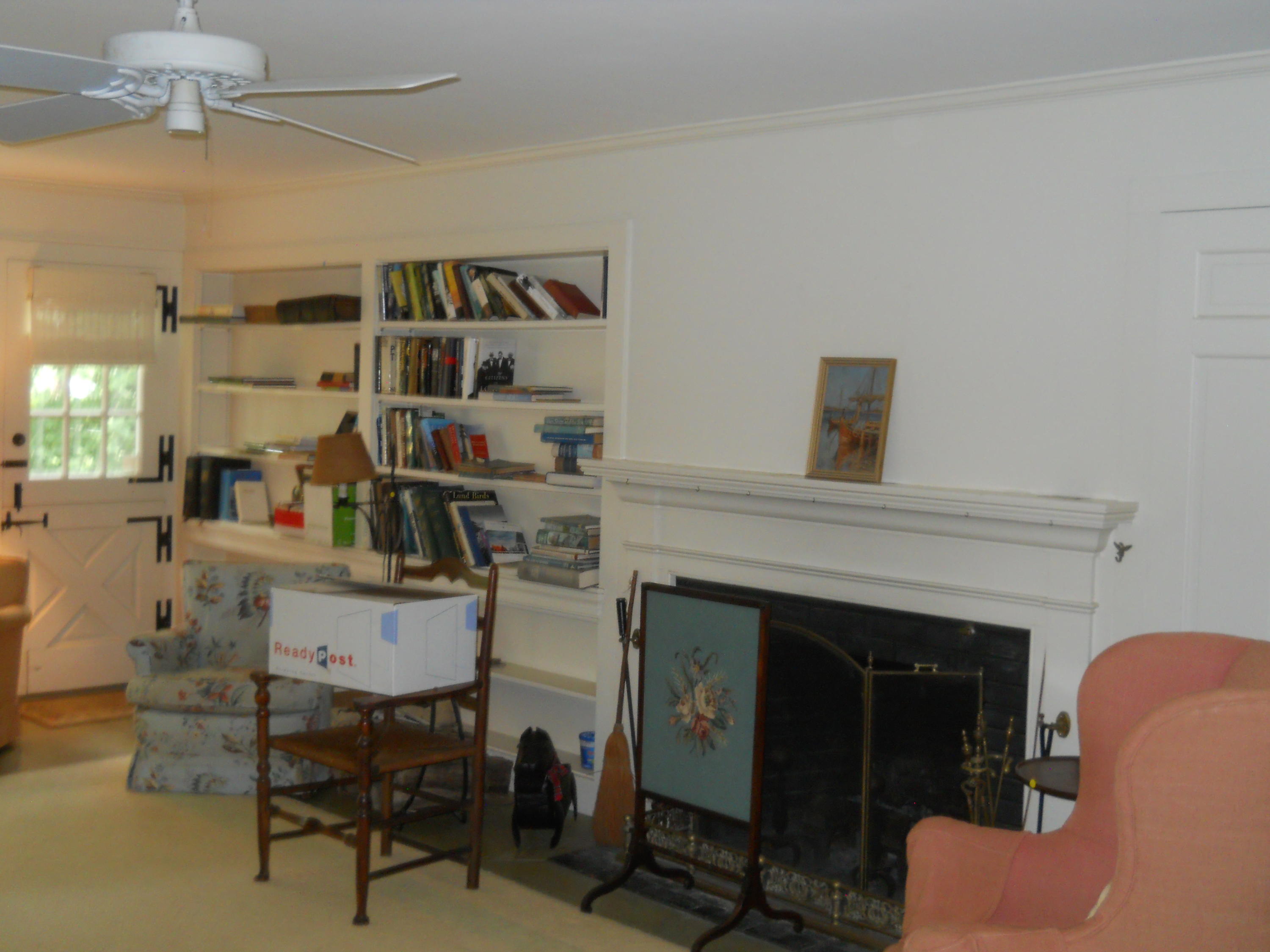 87 Eel River Road Osterville, MA 02655 - Photo 17 of 29 a living room with furniture and a fireplace