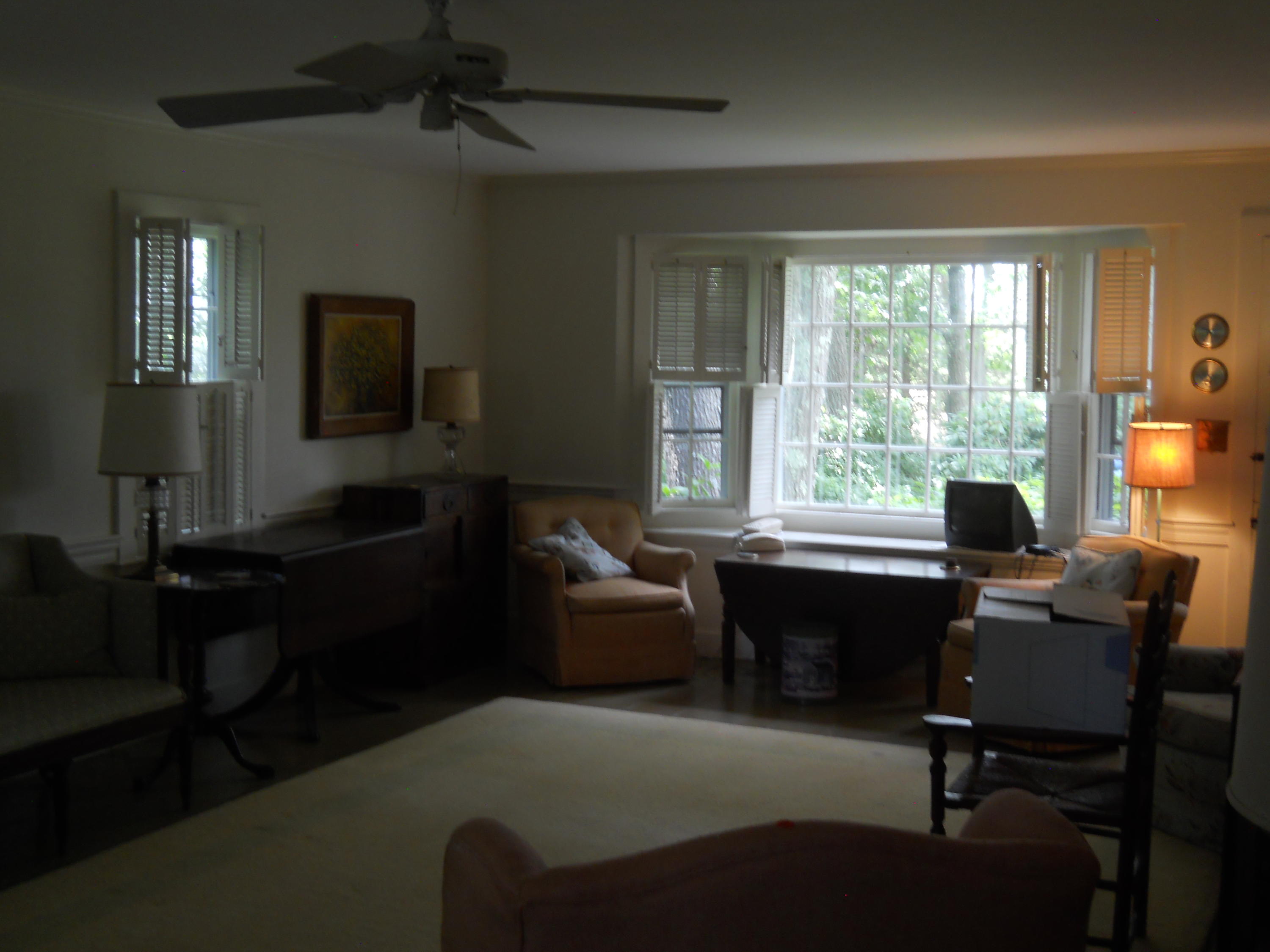 87 Eel River Road Osterville, MA 02655 - Photo 18 of 29 a living room with furniture a flat screen tv and large windows