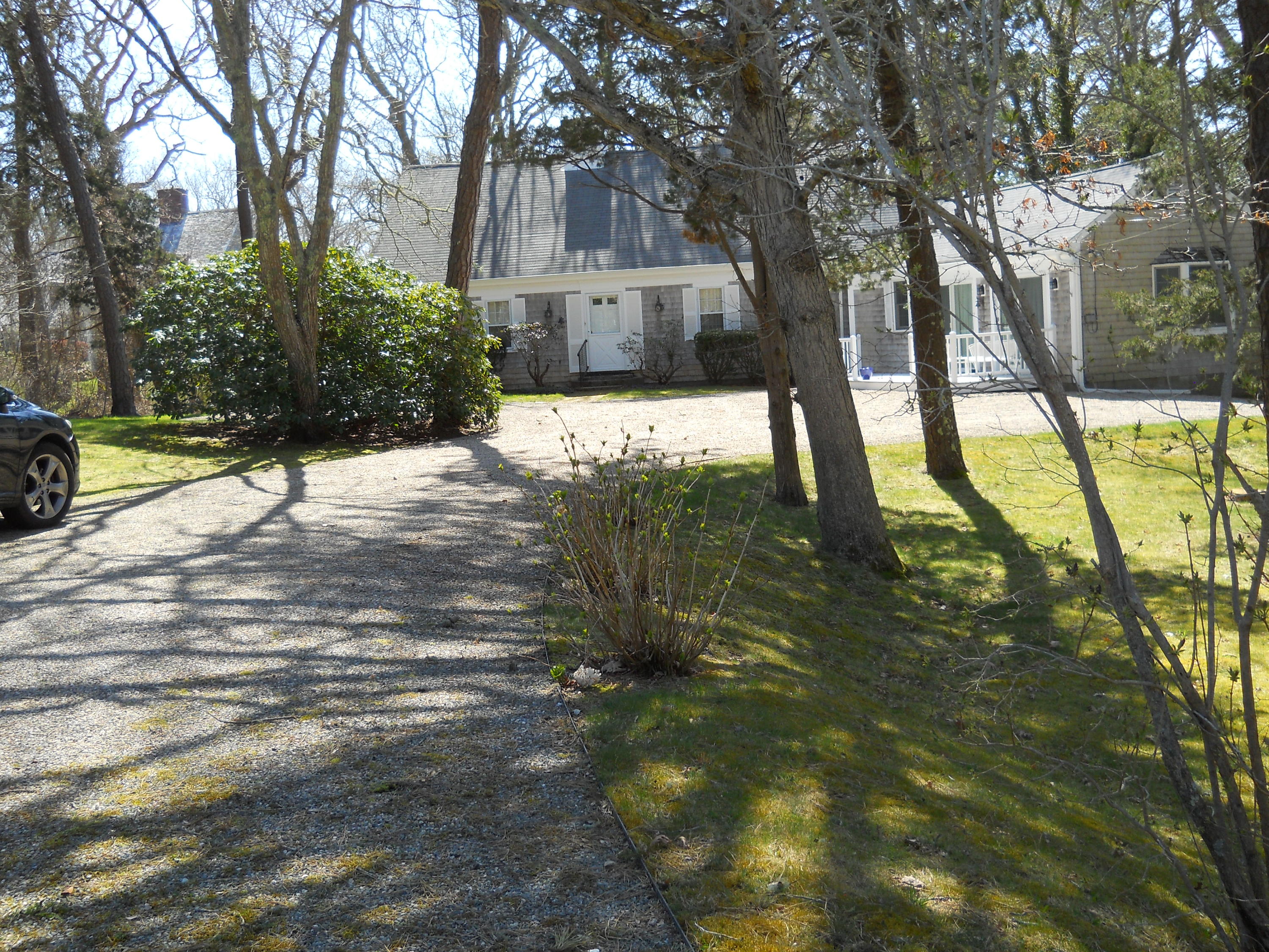 87 Eel River Road Osterville, MA 02655 - Photo 2 of 29 a view of yard along with trees