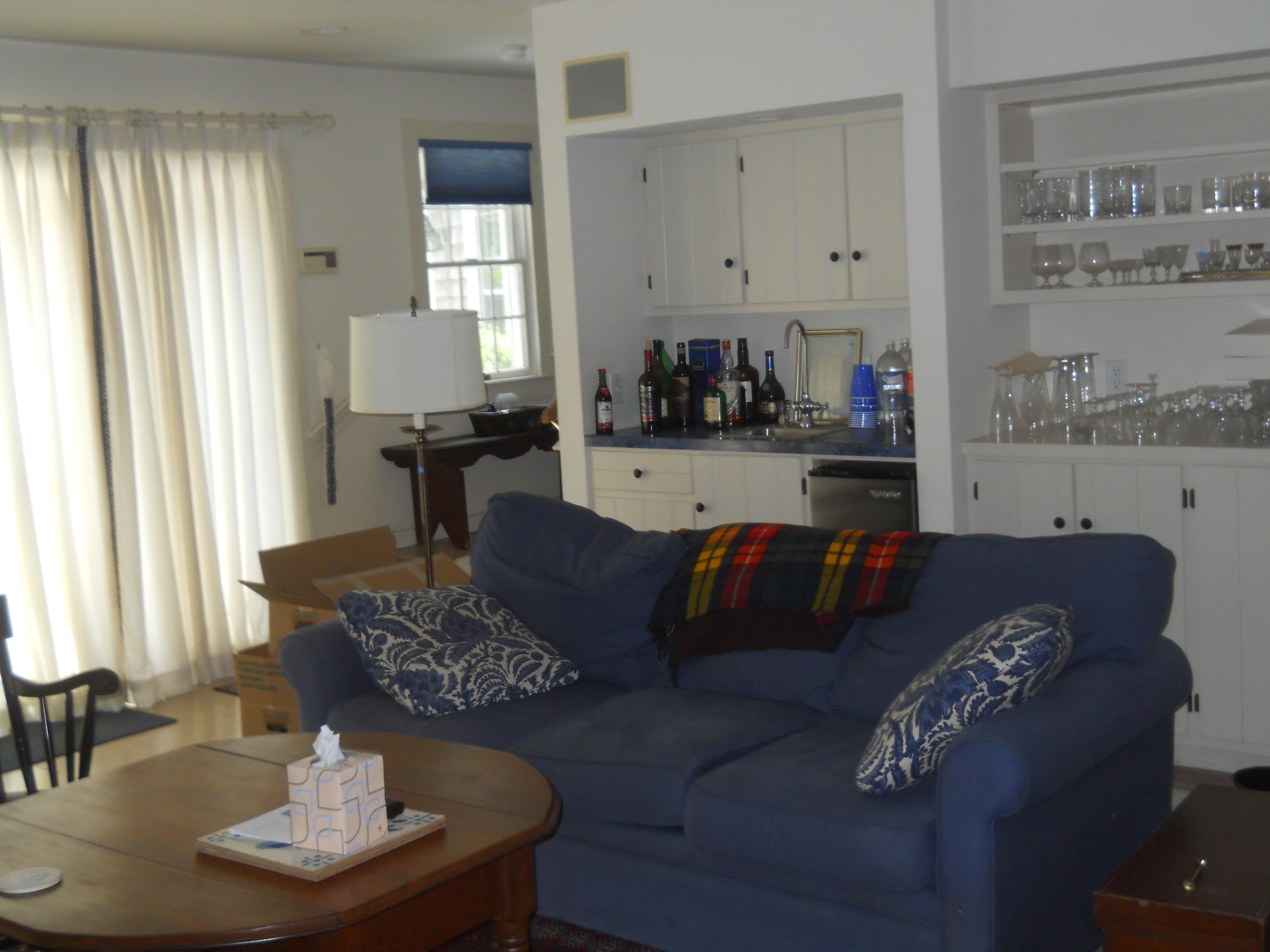 87 Eel River Road Osterville, MA 02655 - Photo 22 of 29 a living room with furniture and a fireplace