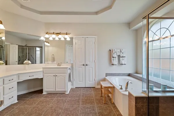 a bathroom with a bathtub and a shower