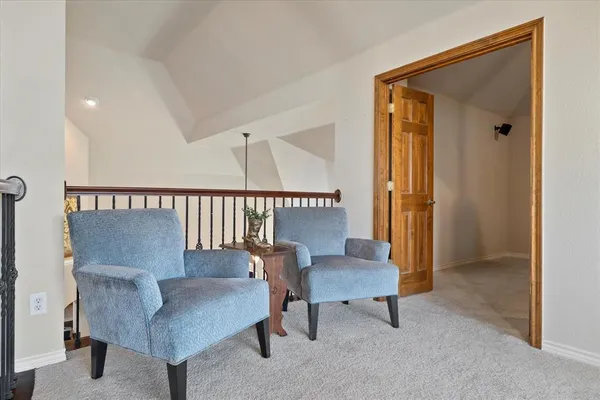 a room with furniture and fan