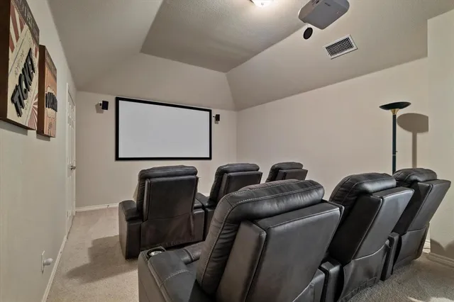 a living room with furniture a ceiling fan and a rug