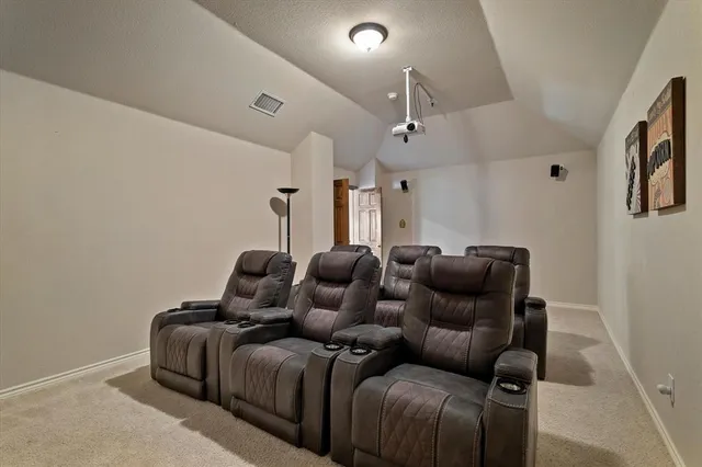 a view of a house with swimming pool and sitting area