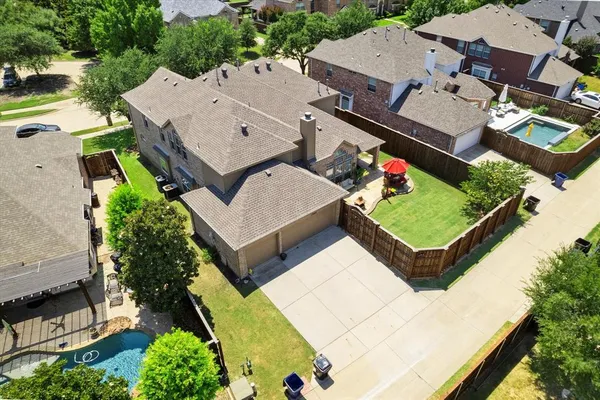 an aerial view of a house with a garden
