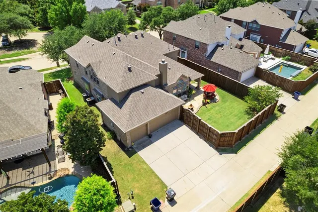 an aerial view of a house with a garden