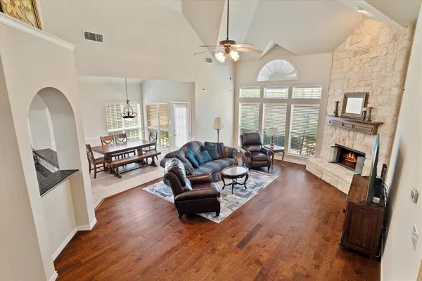 a living room with furniture and a fireplace