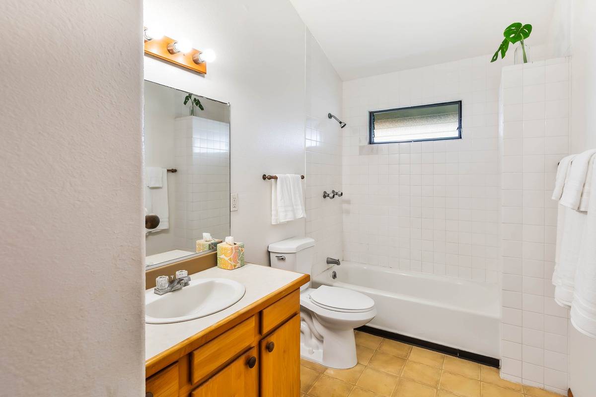 4860 Lani Road Kapaa, HI 96746 - Photo 8 of 30 a bathroom with a sink a toilet and shower