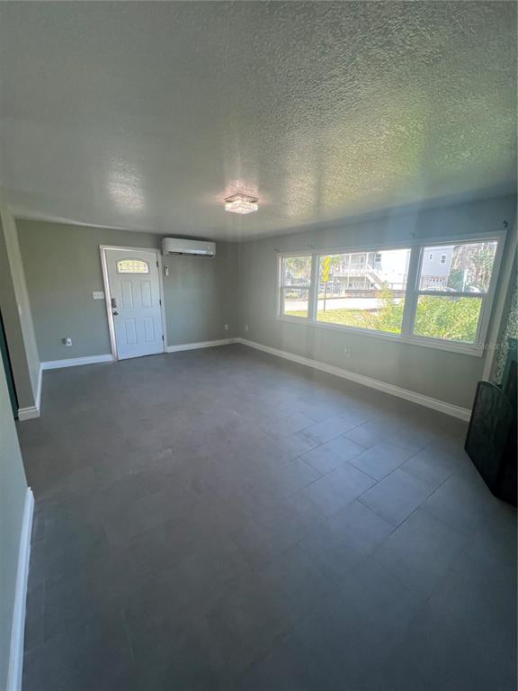 7222 Tropical Drive Weeki Wachee, FL 34607 - Photo 13 of 23 an empty room with windows