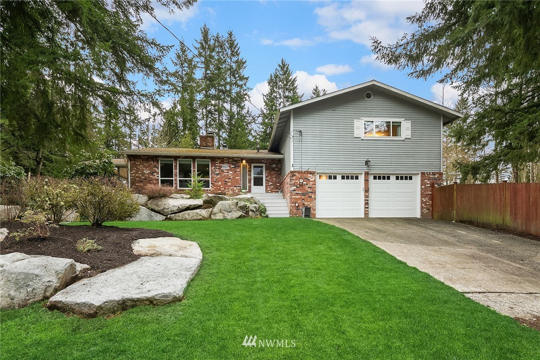 18207 Southeast 147th Street Renton, WA 98059 - Photo 1 of 23 a view of a house with backyard and a garden