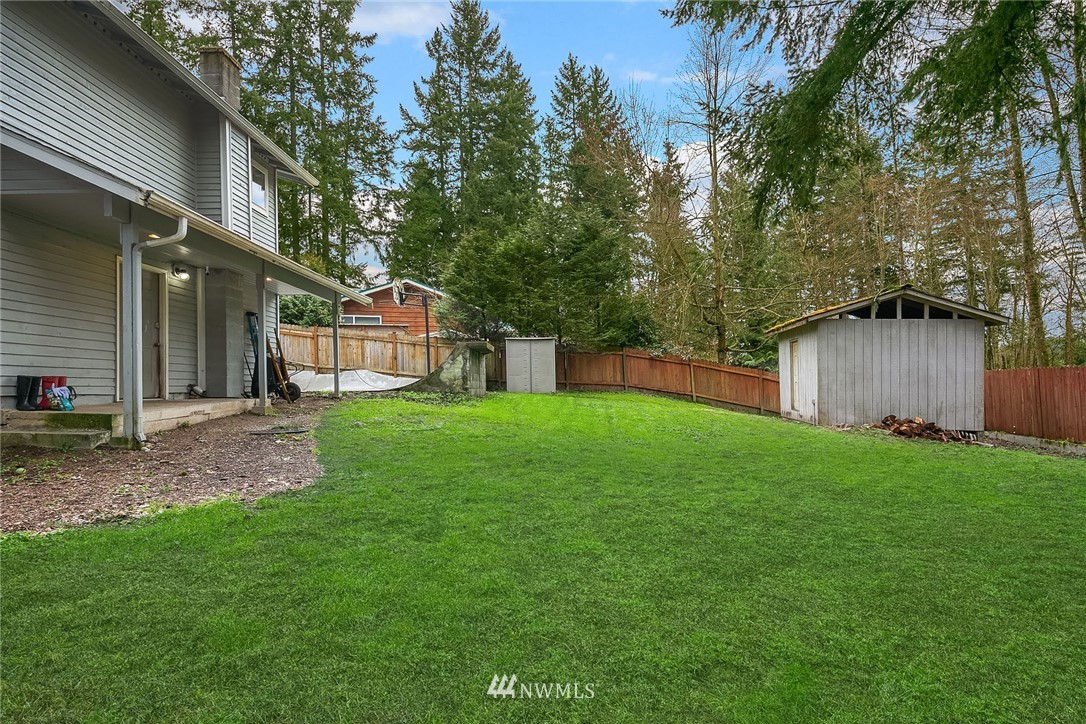 18207 Southeast 147th Street Renton, WA 98059 - Photo 22 of 23 a view of a house with backyard and a tree
