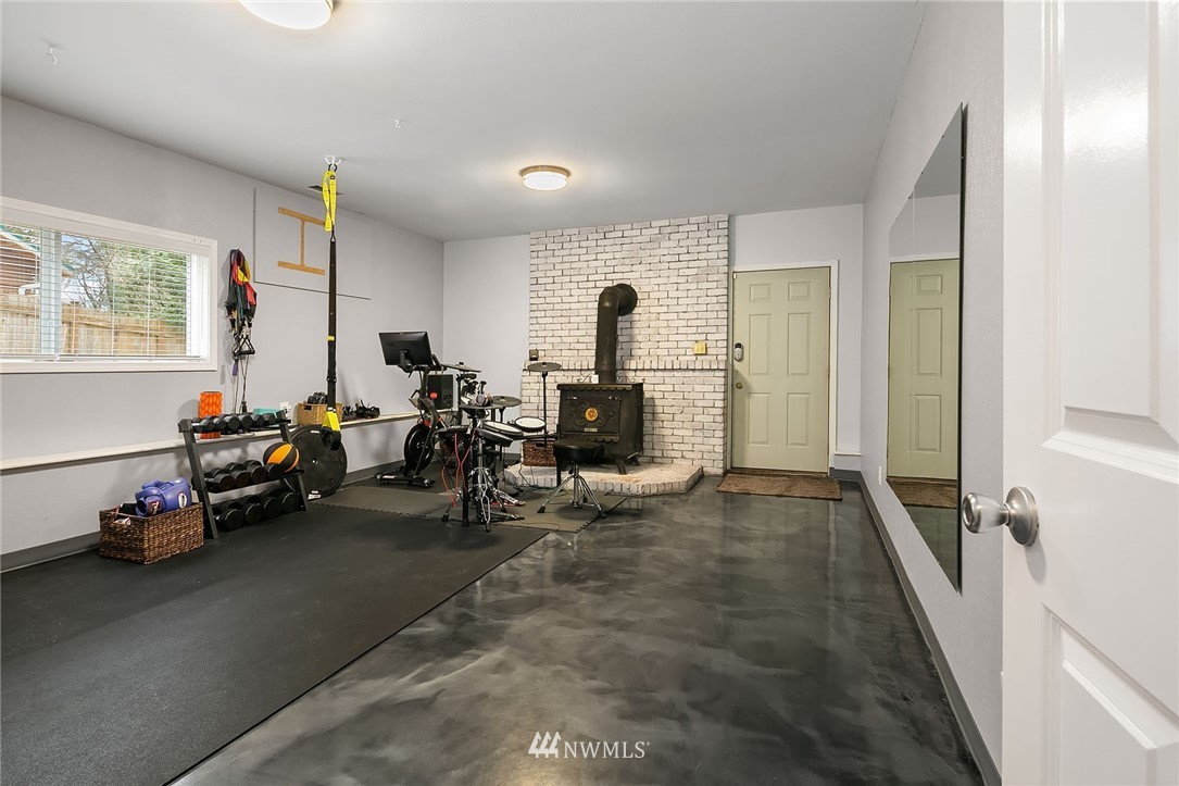 18207 Southeast 147th Street Renton, WA 98059 - Photo 9 of 23 a room with furniture and a wooden floor