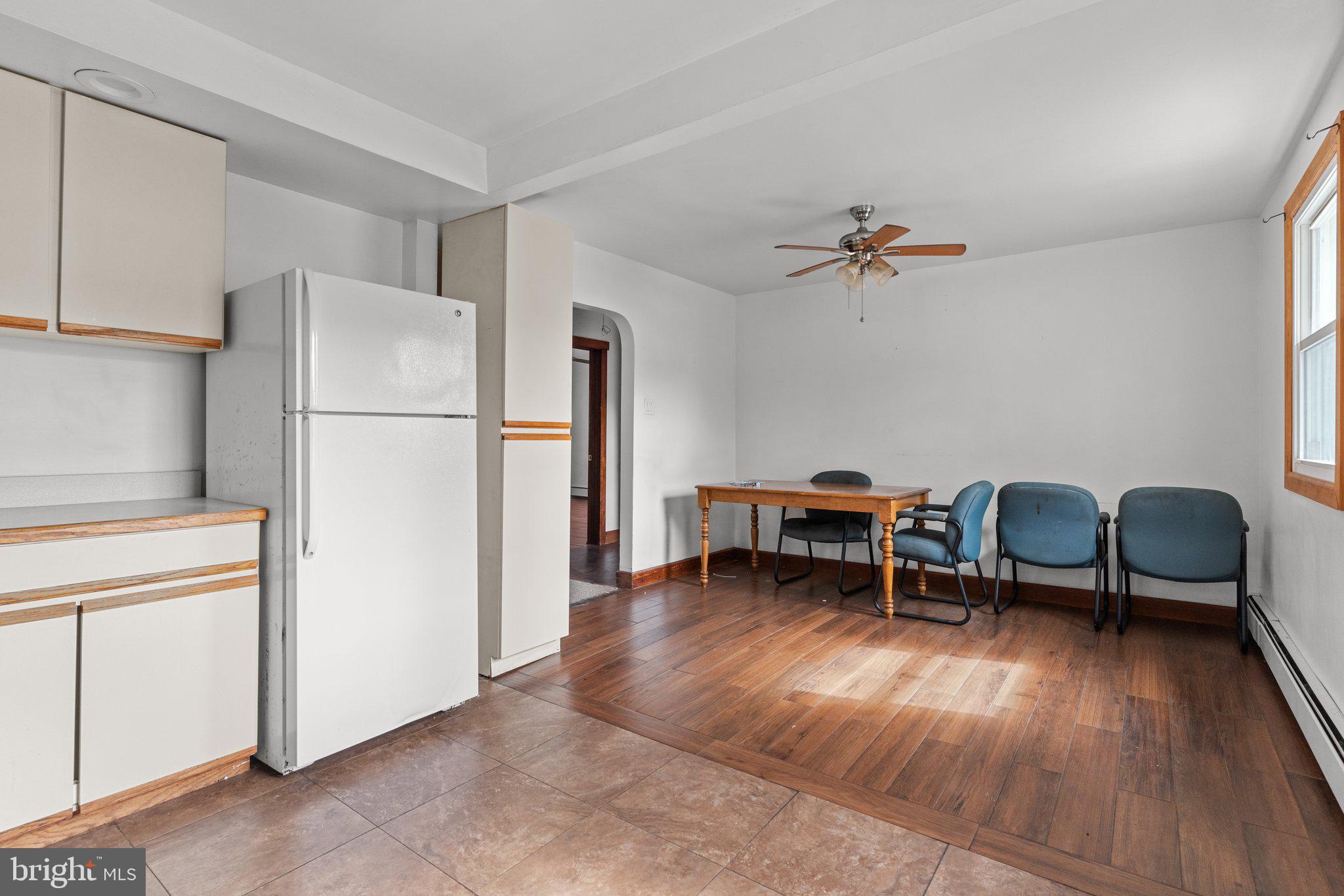 52 East 9th Avenue Pine Hill, NJ 08021 - Photo 13 of 25 a view of a workspace with furniture and a kitchen