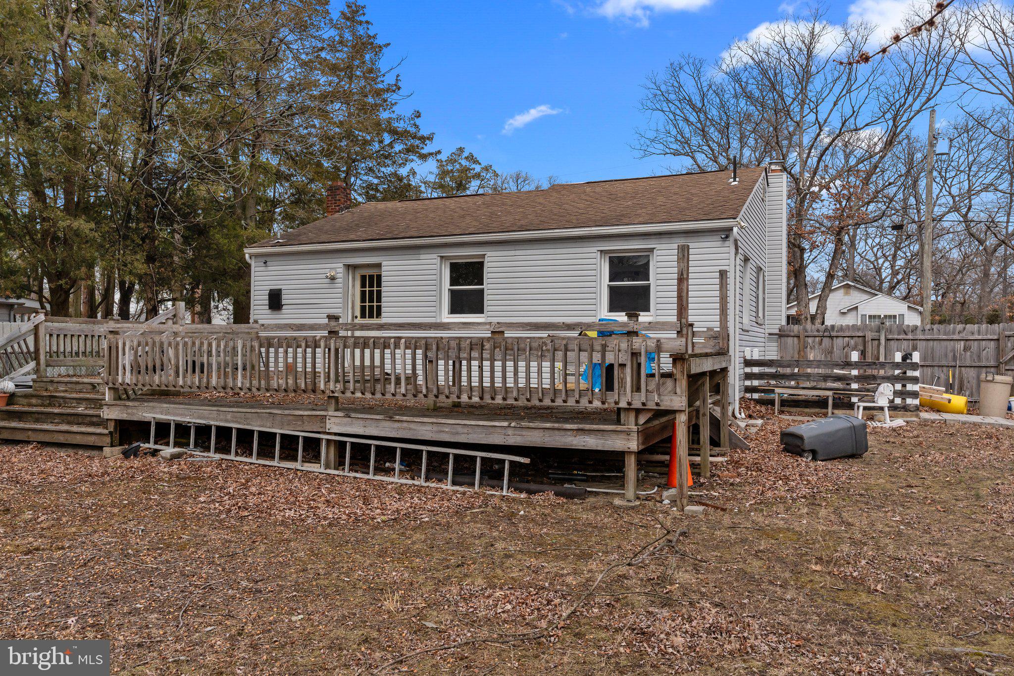 52 East 9th Avenue Pine Hill, NJ 08021 - Photo 21 of 25 a view of a house with wooden deck and furniture