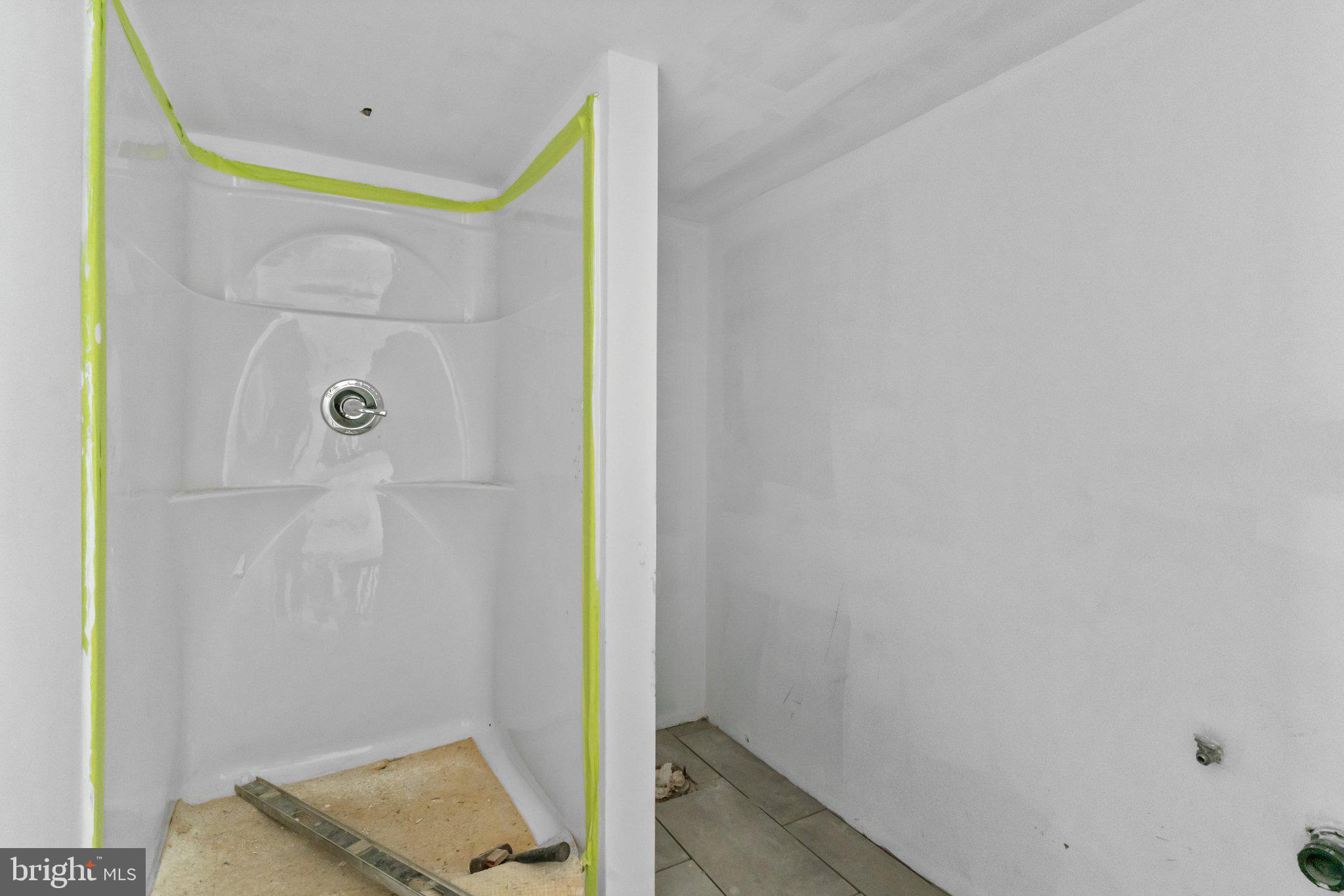 52 East 9th Avenue Pine Hill, NJ 08021 - Photo 23 of 25 a bathroom with a bathtub and shower