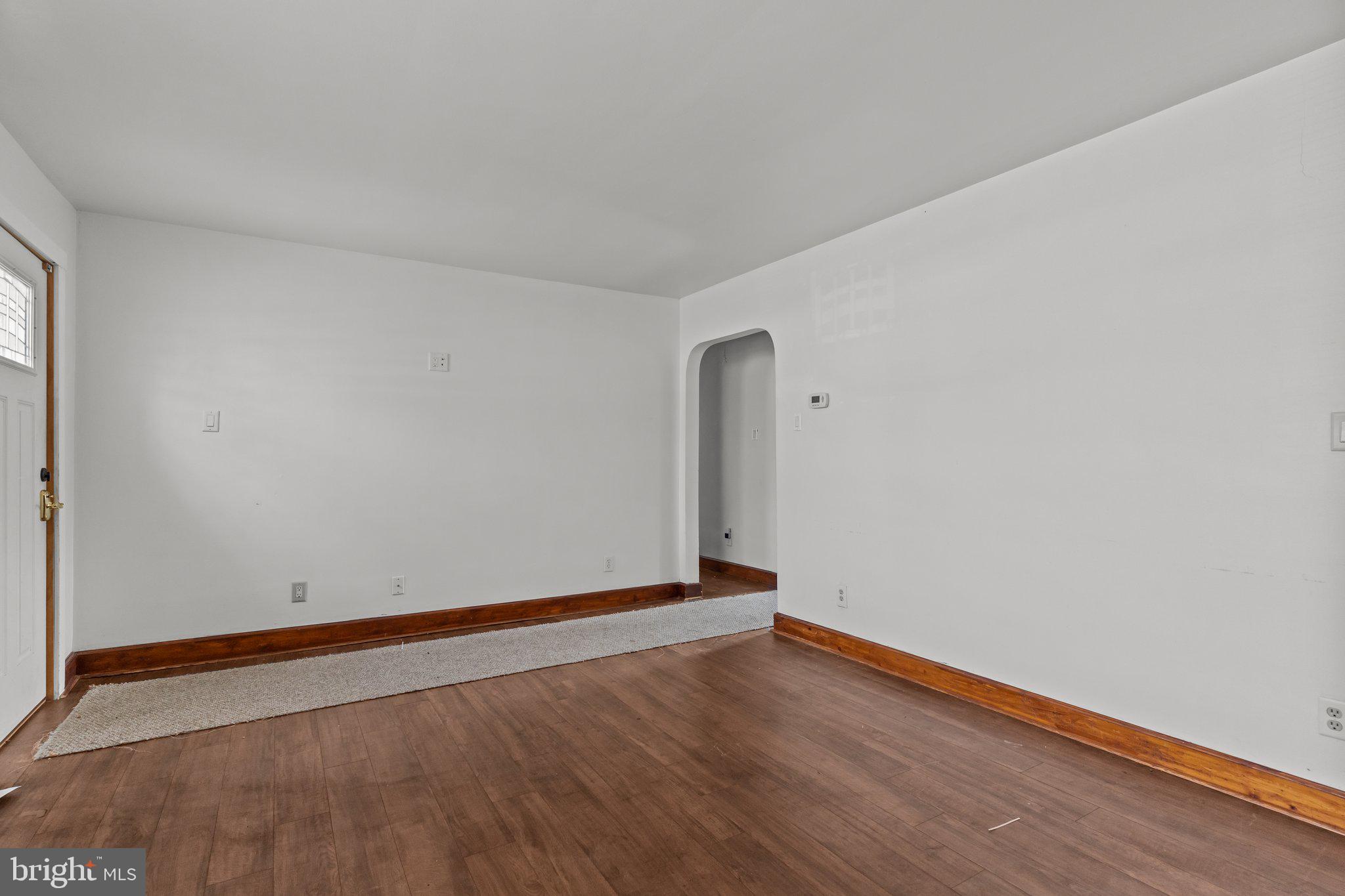 52 East 9th Avenue Pine Hill, NJ 08021 - Photo 5 of 25 a view of an empty room with wooden floor