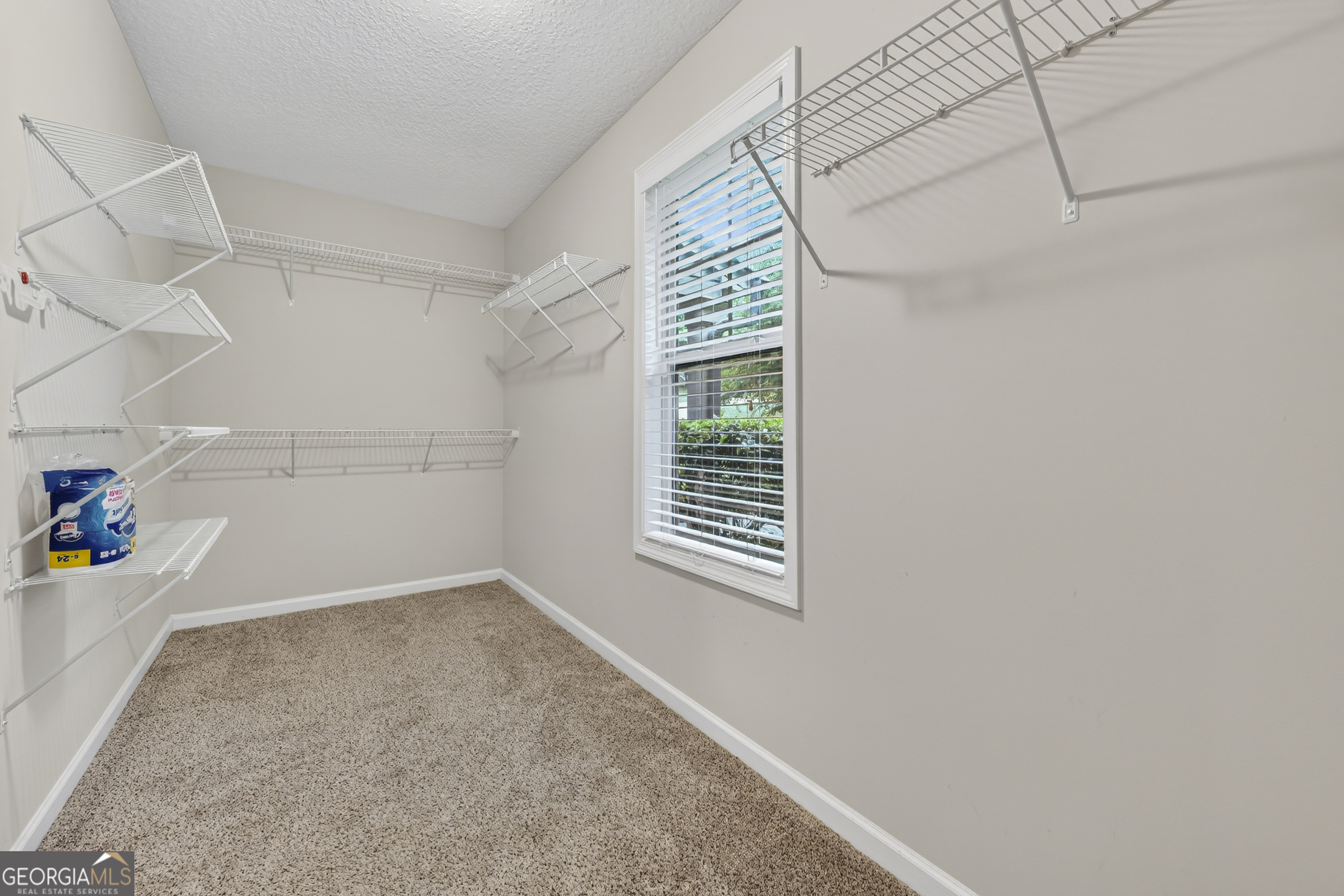717 Oconee Lane Commerce, GA 30529 - Photo 23 of 57 a view of a storage & utility room with a window