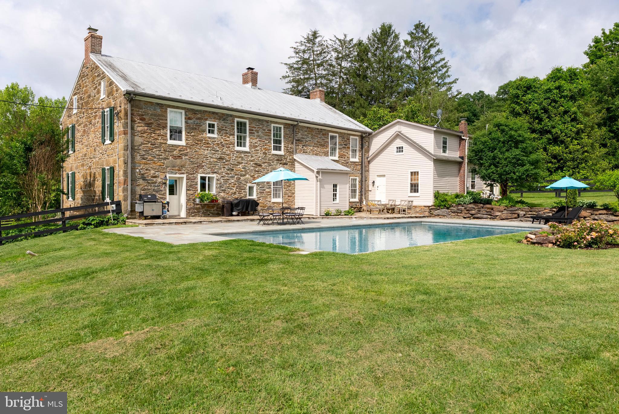 2810 Hoffman Mill Road Hampstead, MD 21074 - Photo 104 of 121 a front view of a house with a garden and trees