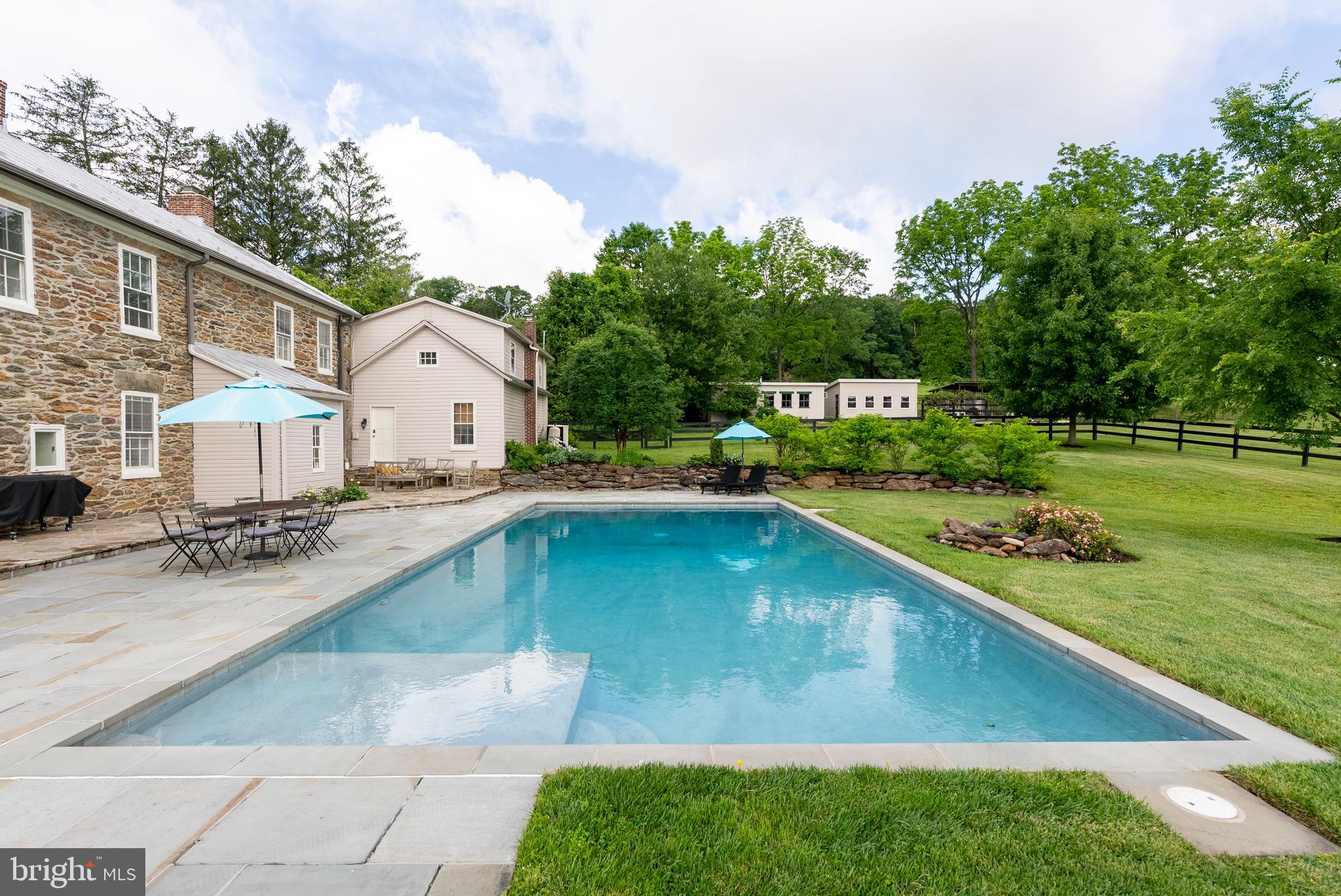 2810 Hoffman Mill Road Hampstead, MD 21074 - Photo 27 of 121 a view of a swimming pool with a garden and trees
