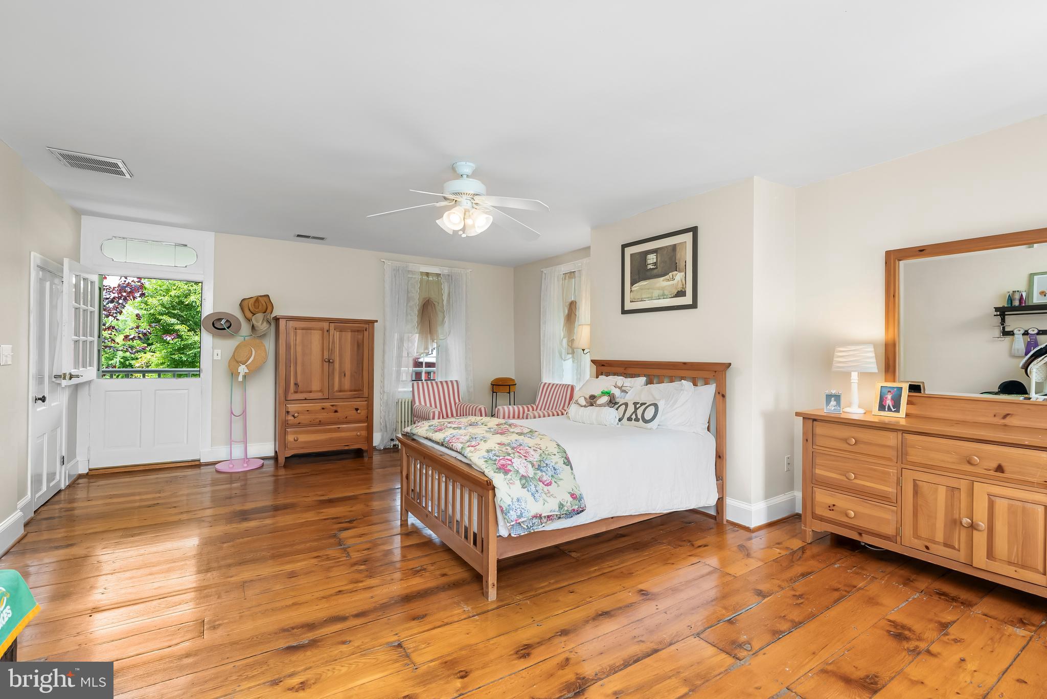 2810 Hoffman Mill Road Hampstead, MD 21074 - Photo 52 of 121 a spacious bedroom with a bed and a table in it
