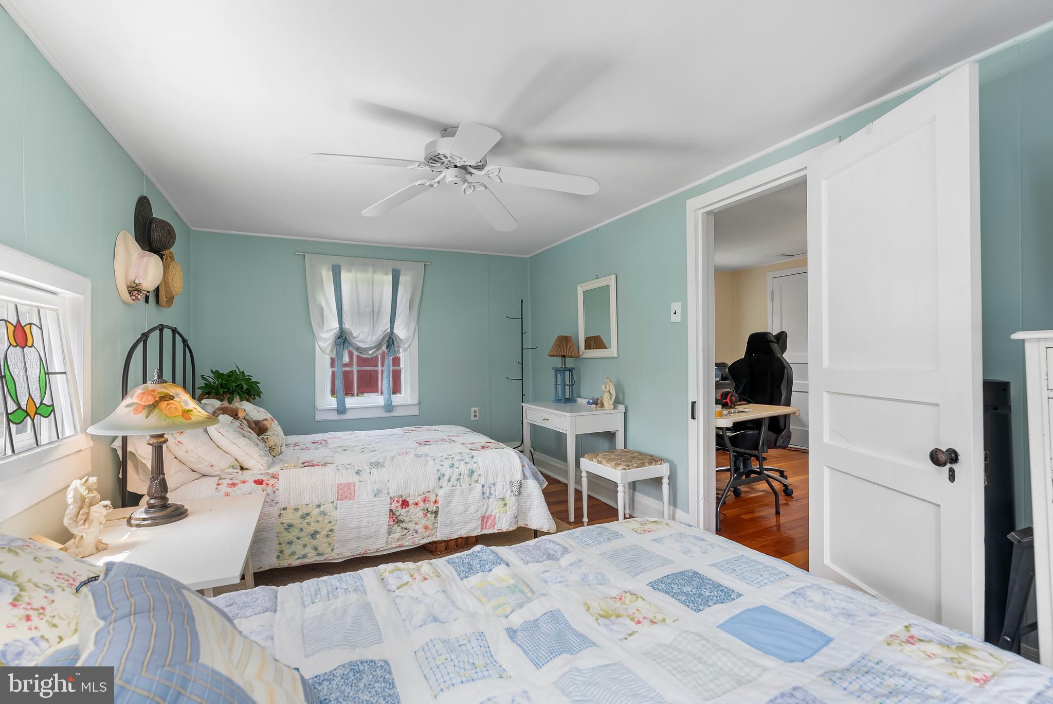 2810 Hoffman Mill Road Hampstead, MD 21074 - Photo 68 of 121 a bedroom with a bed and a chandelier