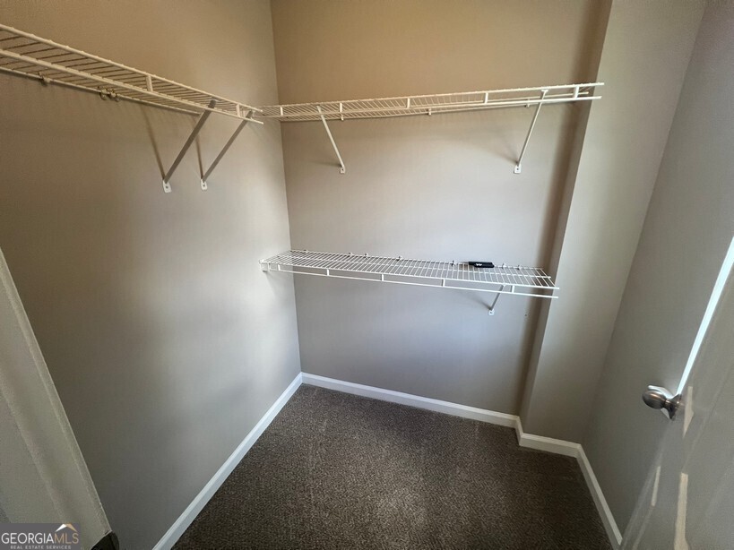 70 Princeton Way Covington, GA 30016 - Photo 18 of 32 a view of an empty walk in closet