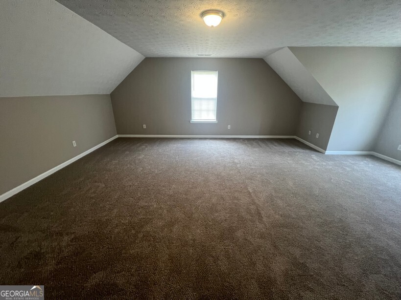 70 Princeton Way Covington, GA 30016 - Photo 26 of 32 wooden floor and window in an empty room