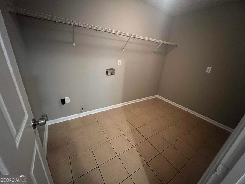 70 Princeton Way Covington, GA 30016 - Photo 31 of 32 a view of a room with racks on the wall