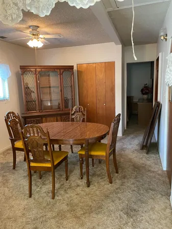 a dining room with furniture and window