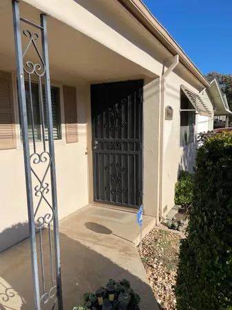 a front view of a house with parking space