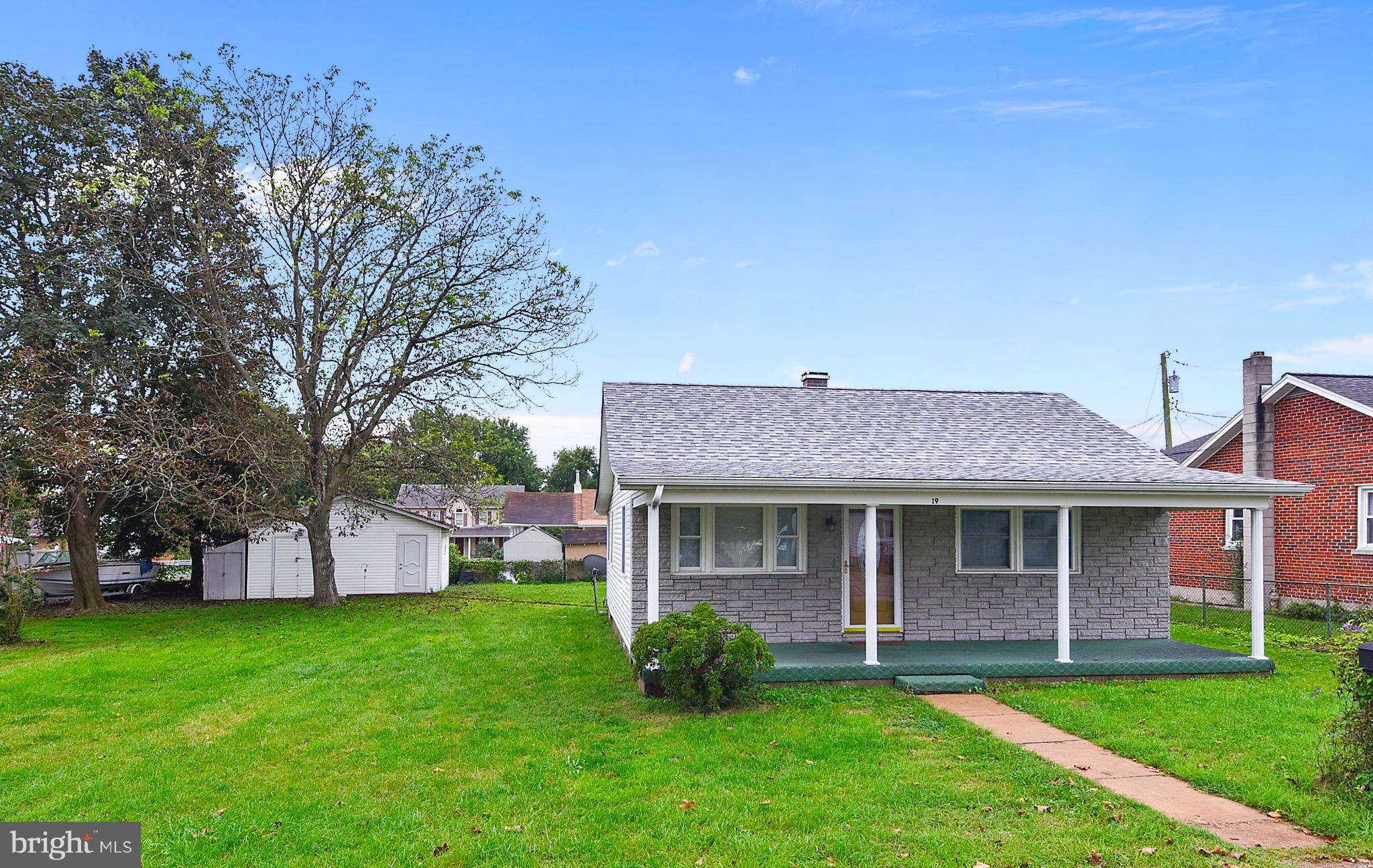 Front of house and side yard, including shed