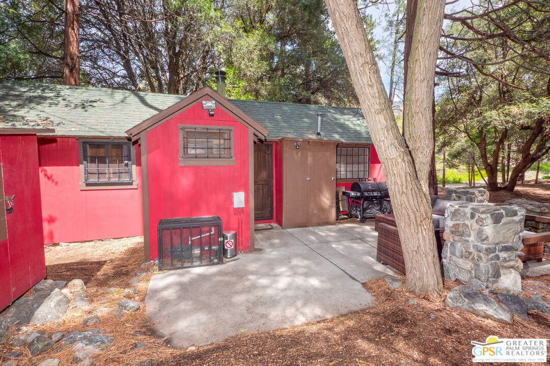 76 7 Oaks Road Angelus Oaks, CA 92305 - Photo 21 of 35 a front view of a house with a yard