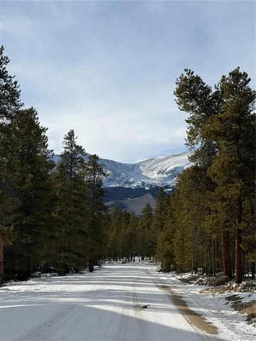 a view of a road with a building in the background
